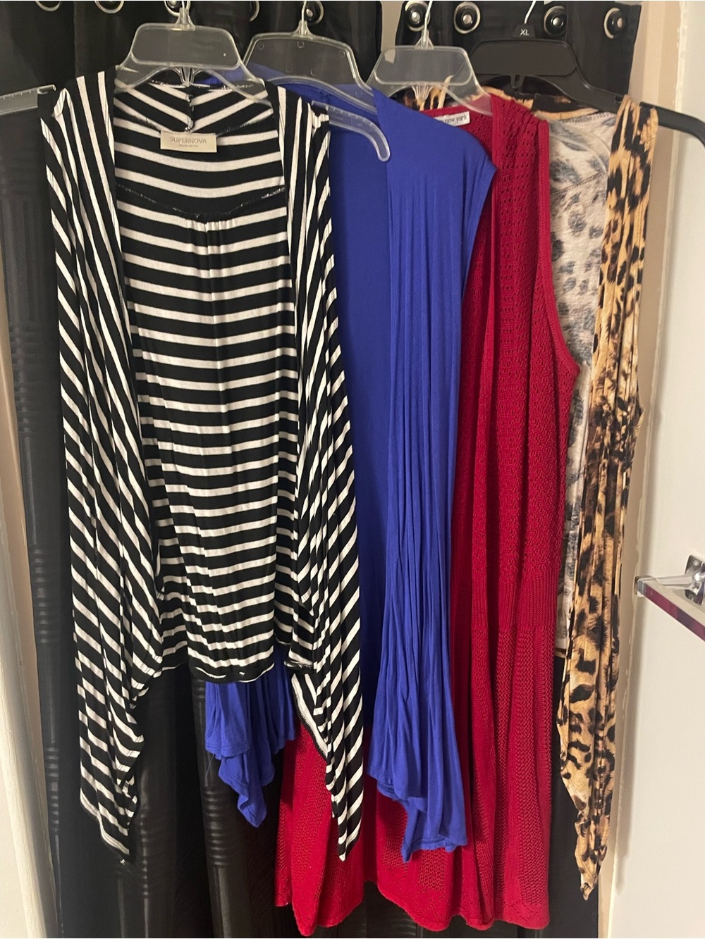 Bundle of 4 Open-Front Women's sleeveless vest.